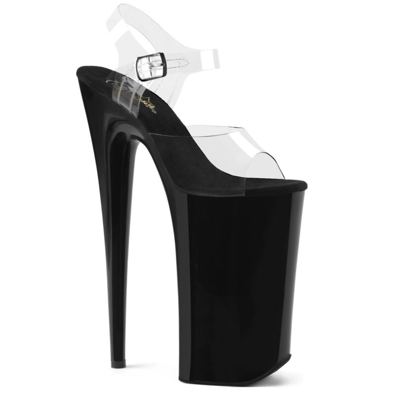 Durchsichtige Extrem High Heels Riemchen Sandalette mit 25 cm Absatz, 16 cm Plateau und weichgepolsterte schwarze Innensohle aus Leder.